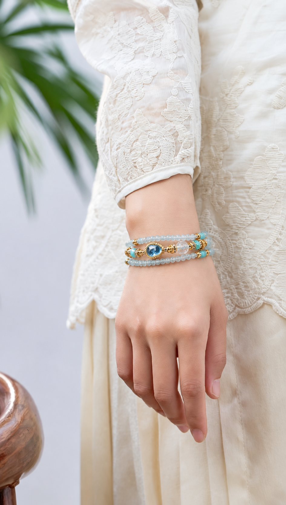 Gemini aquamarine zodiac bracelet worn on a model wrist