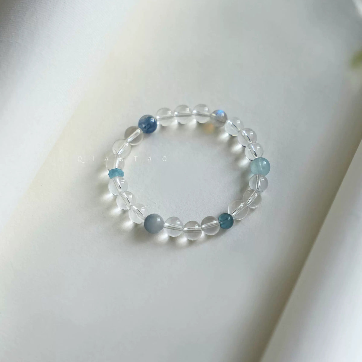 Tide clear quartz and blue gemstone bracelet in soft daylight