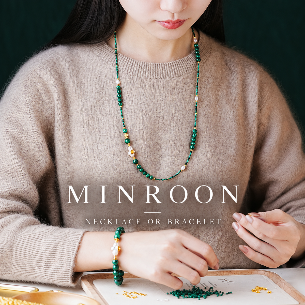 Model wearing the Peacock Plume malachite strand as a necklace and bracelet