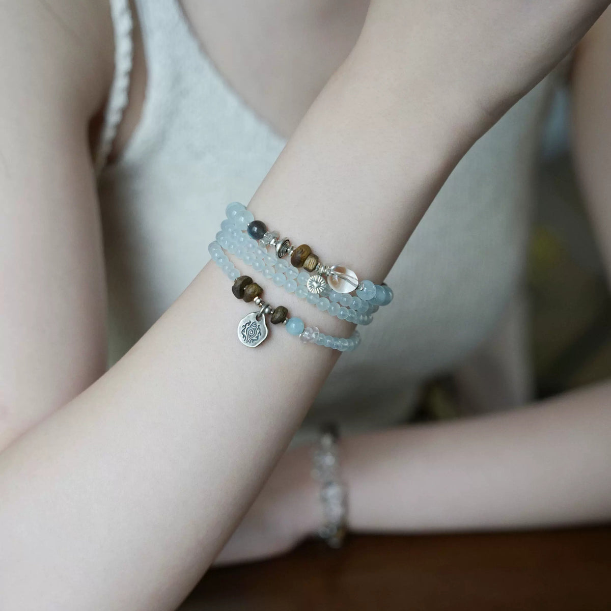 Dawn aquamarine wrap bracelet close-up on model
