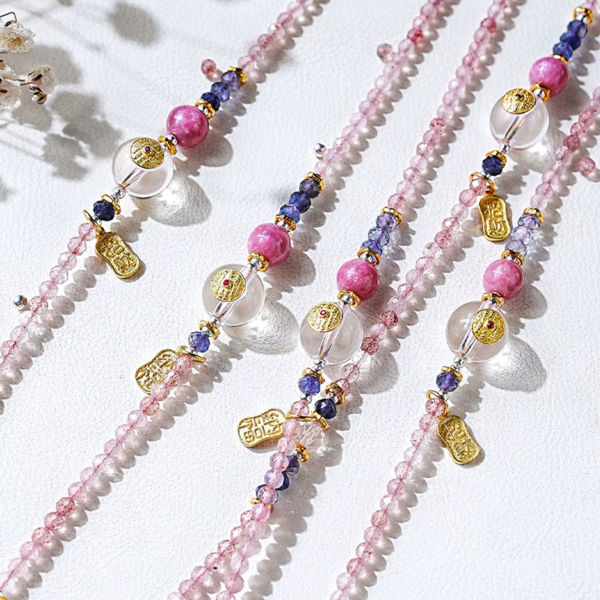 Close-up of strawberry quartz, rhodochrosite, iolite and clear crystal details