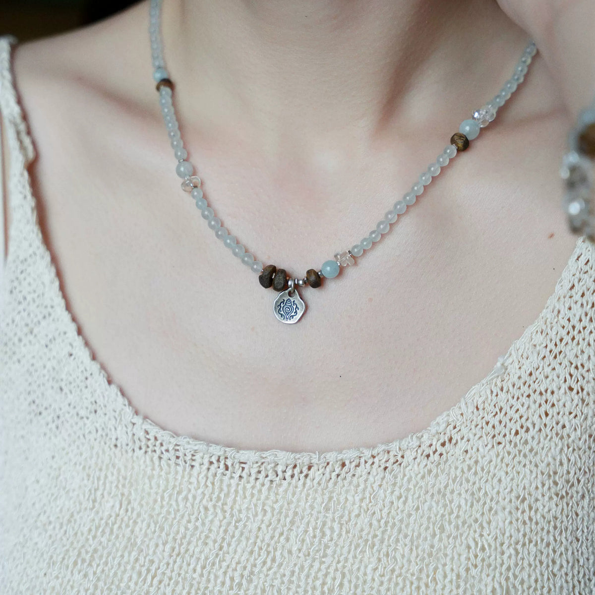 Dawn convertible aquamarine strand worn as a necklace