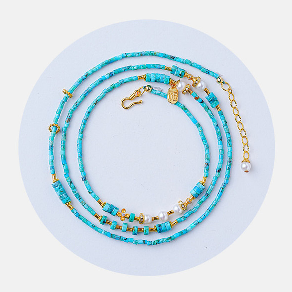 Convertible turquoise and pearl necklace overhead view