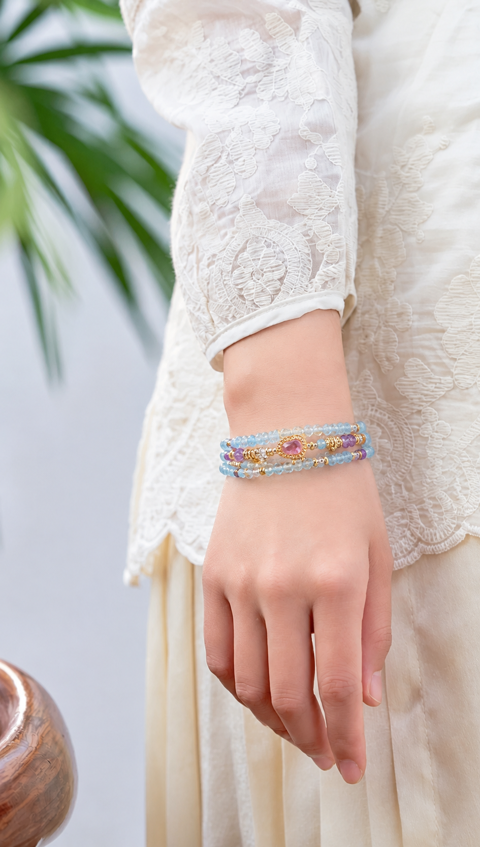 Aquarius aquamarine zodiac bracelet worn on a model wrist