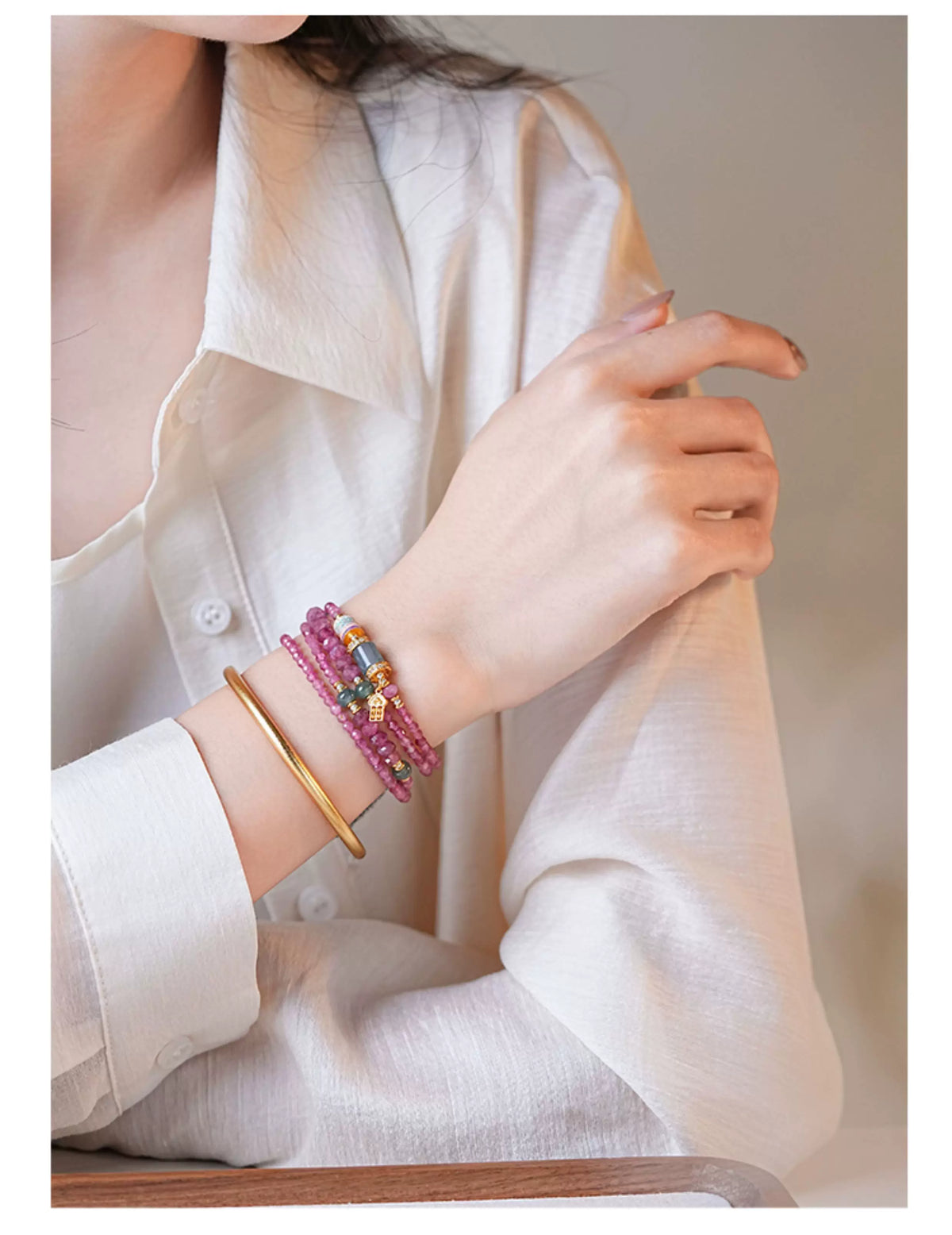 Model wearing the pink tourmaline multi-wrap strand with a white shirt