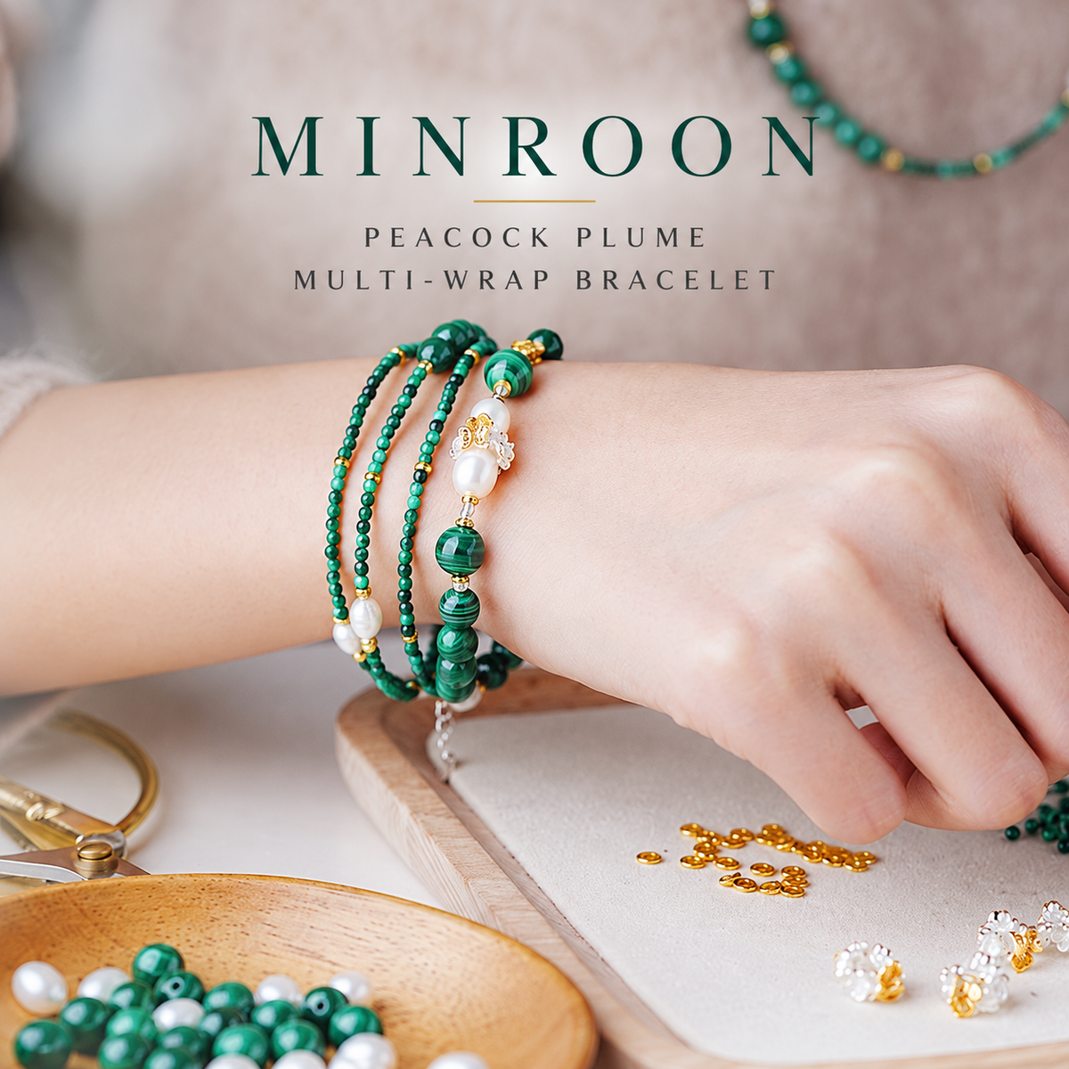 Model wearing the Peacock Plume malachite strand as a multi-wrap bracelet