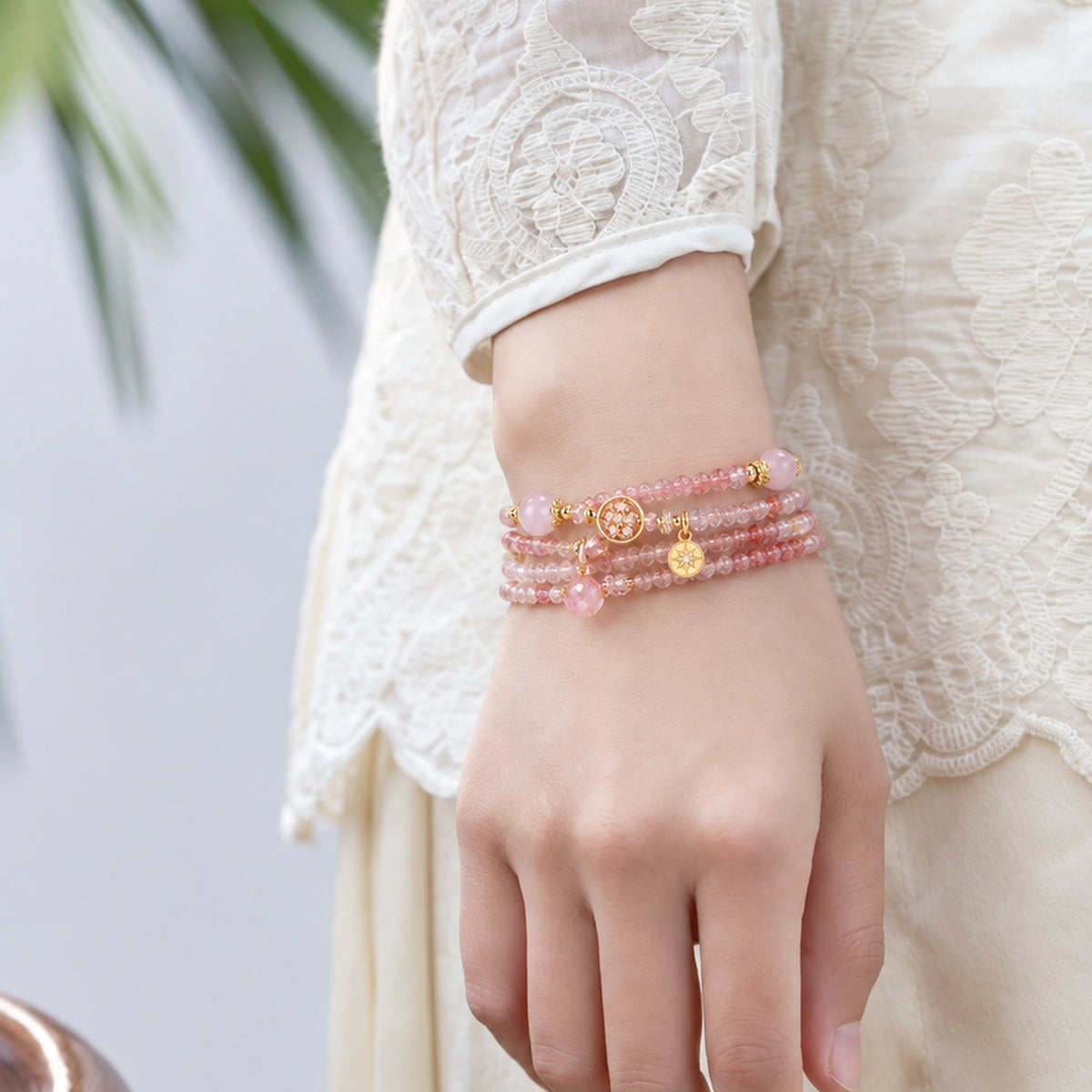 Libra Strawberry Quartz Zodiac Wrap Bracelet worn on the wrist in a standing pose