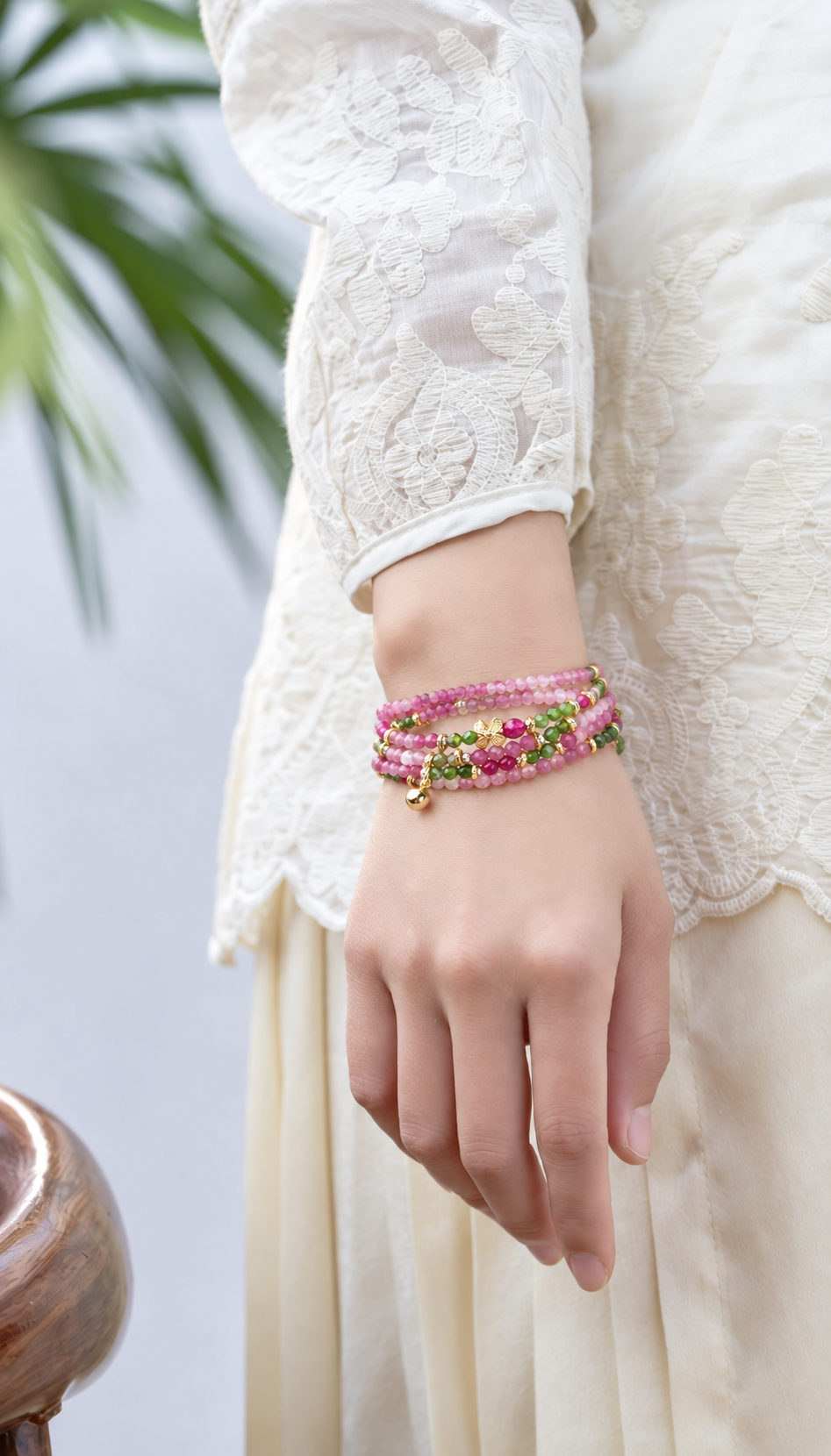 Virgo Pink Tourmaline Zodiac Wrap Bracelet worn on the wrist in a standing pose