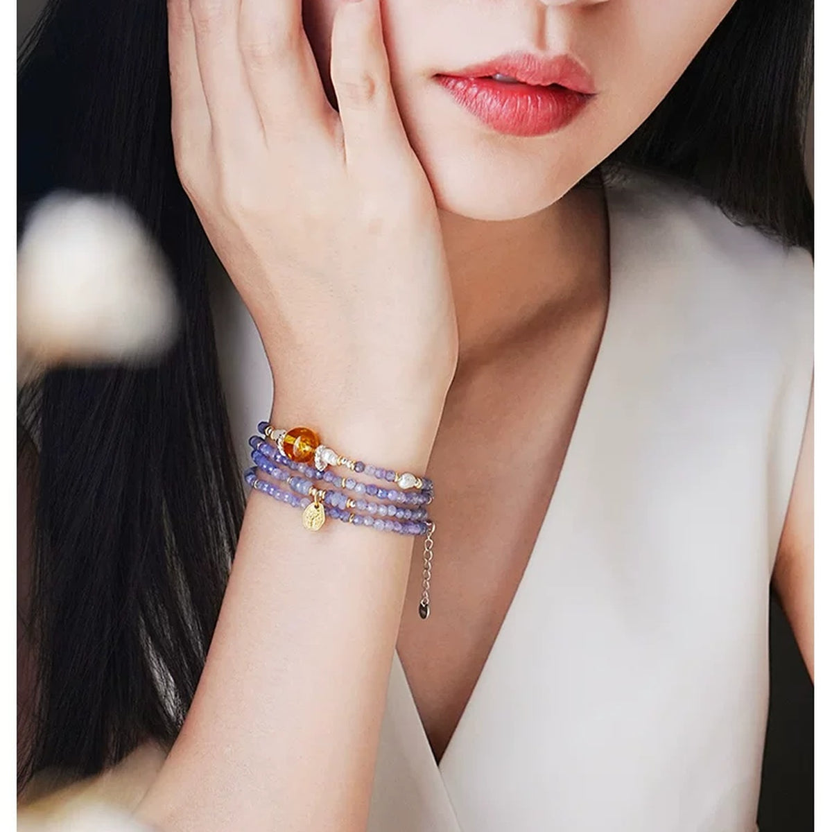 Model wearing the Cancer Tanzanite multi-wrap bracelet