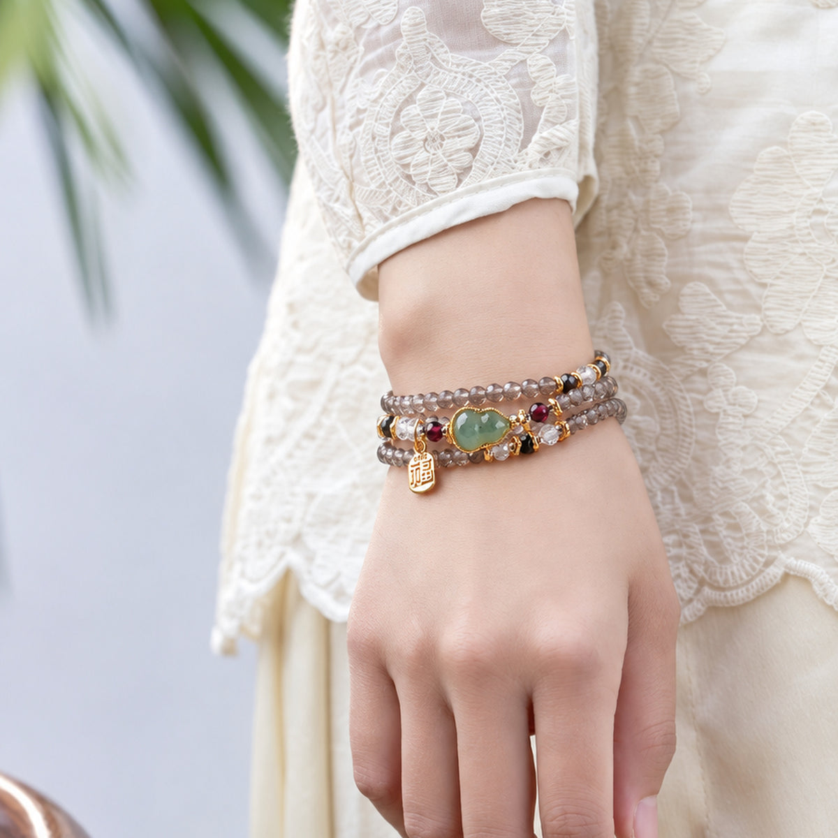 Scorpio Ice Obsidian Zodiac Wrap Bracelet worn on the wrist in a standing pose