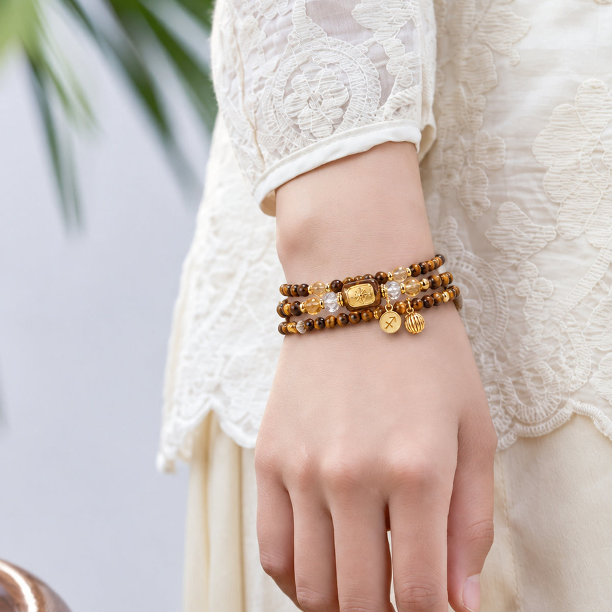 Sagittarius Tiger's Eye Zodiac Wrap Bracelet worn on the wrist in a standing pose