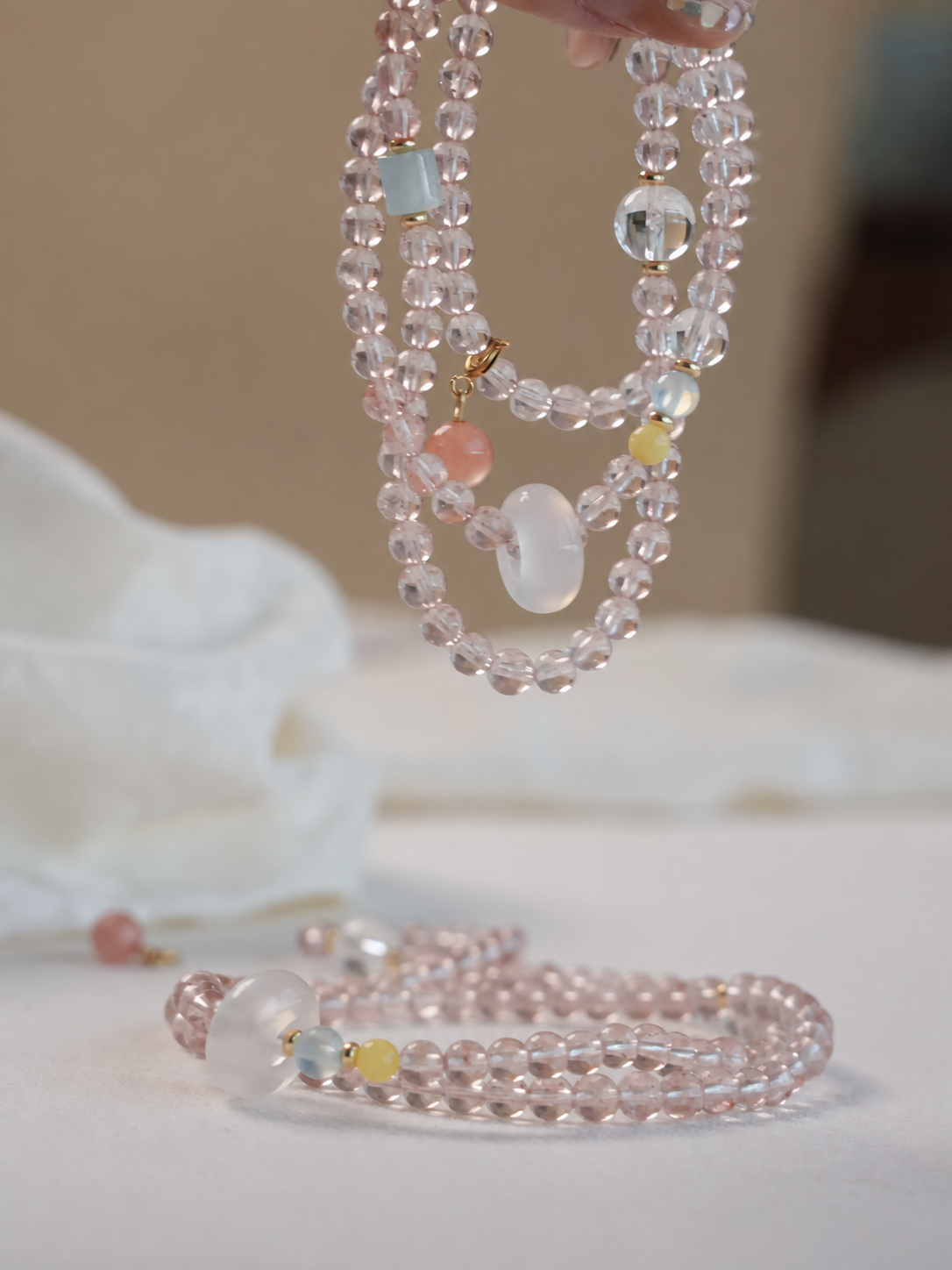Cloud Weave strawberry quartz bracelet and necklace product display
