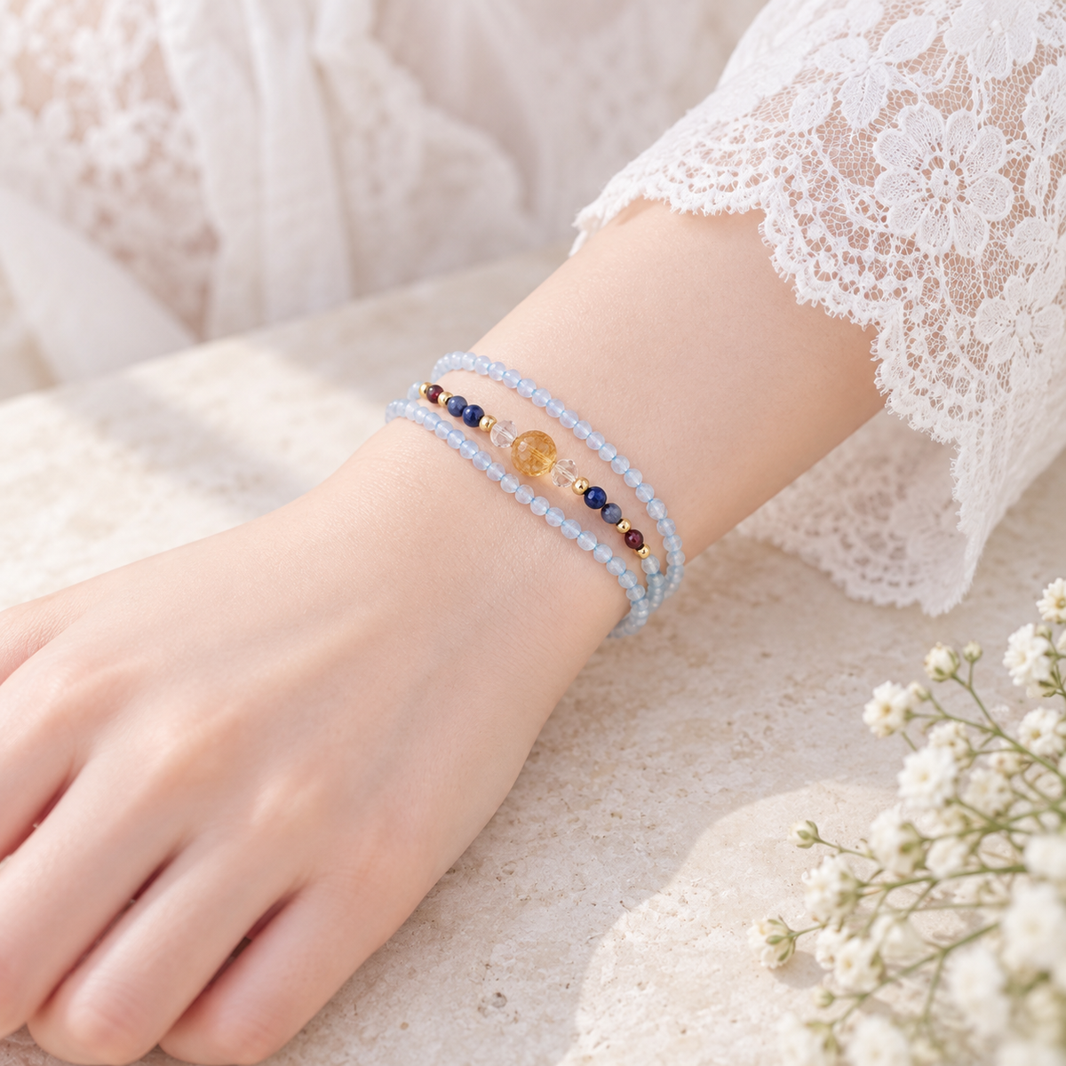 Wrist detail showing the Pisces Aquamarine wrap bracelet