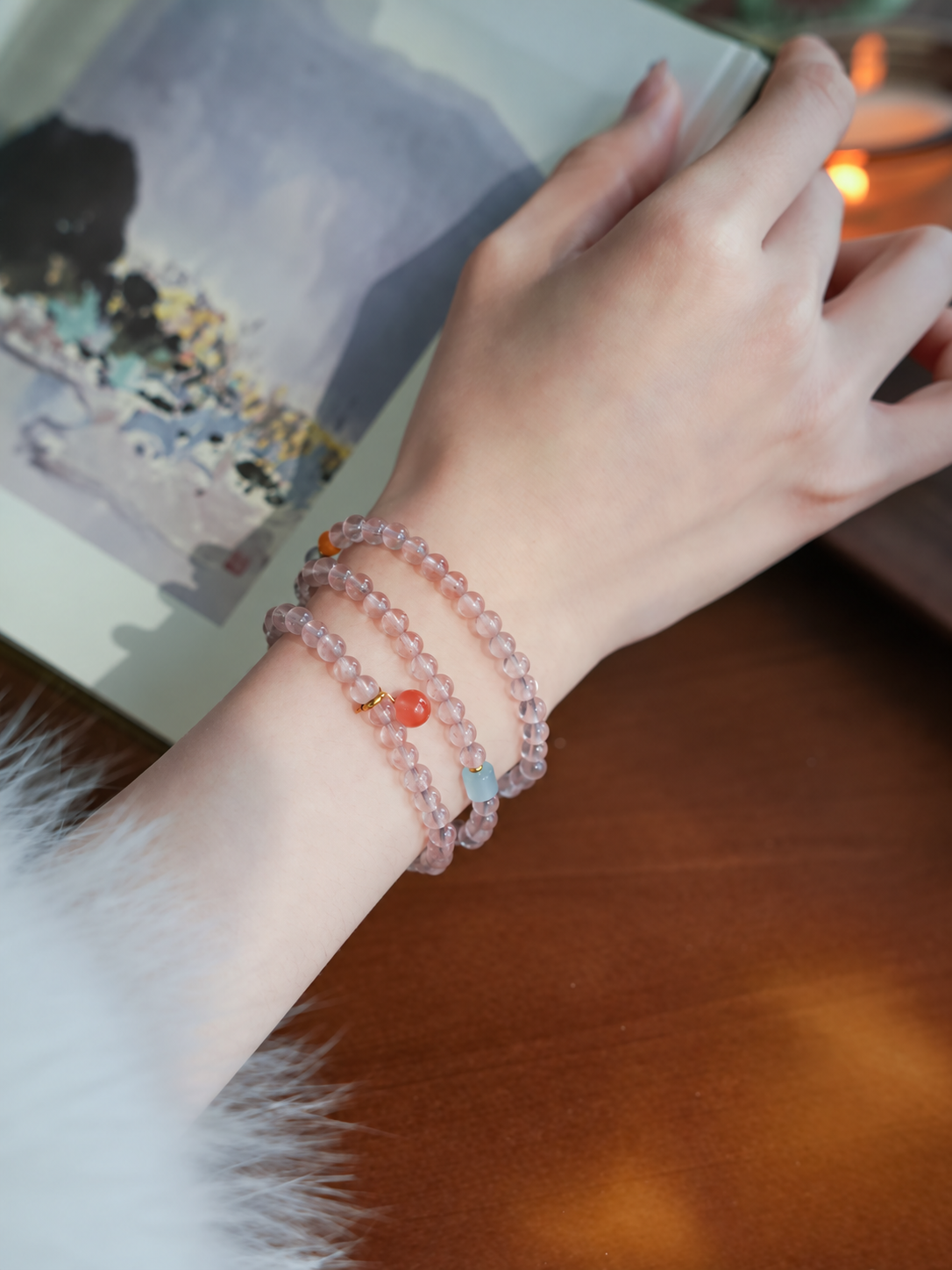 Cloud Weave strawberry quartz wrap bracelet close-up on wrist