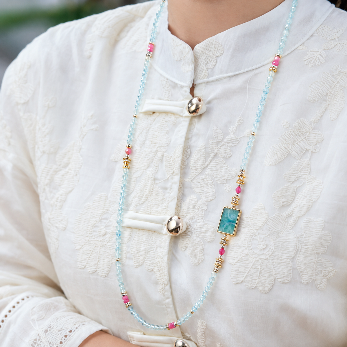 Scorpio aquamarine convertible necklace worn by a model