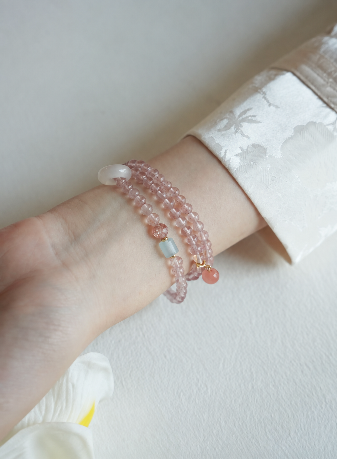 Cloud Weave strawberry quartz wrap bracelet detail on wrist