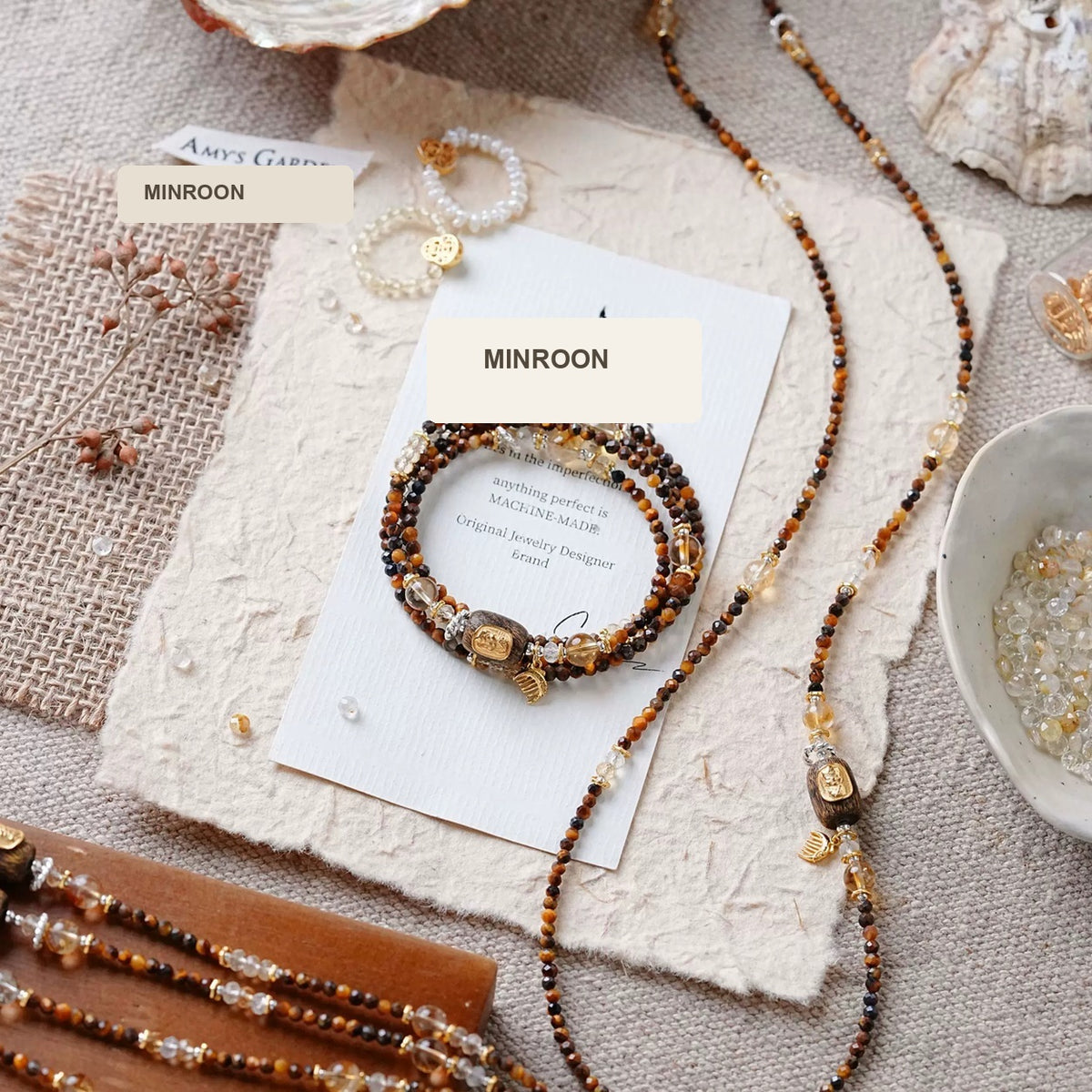 Annual Rings tiger's eye necklace and wrap bracelet styled flat lay