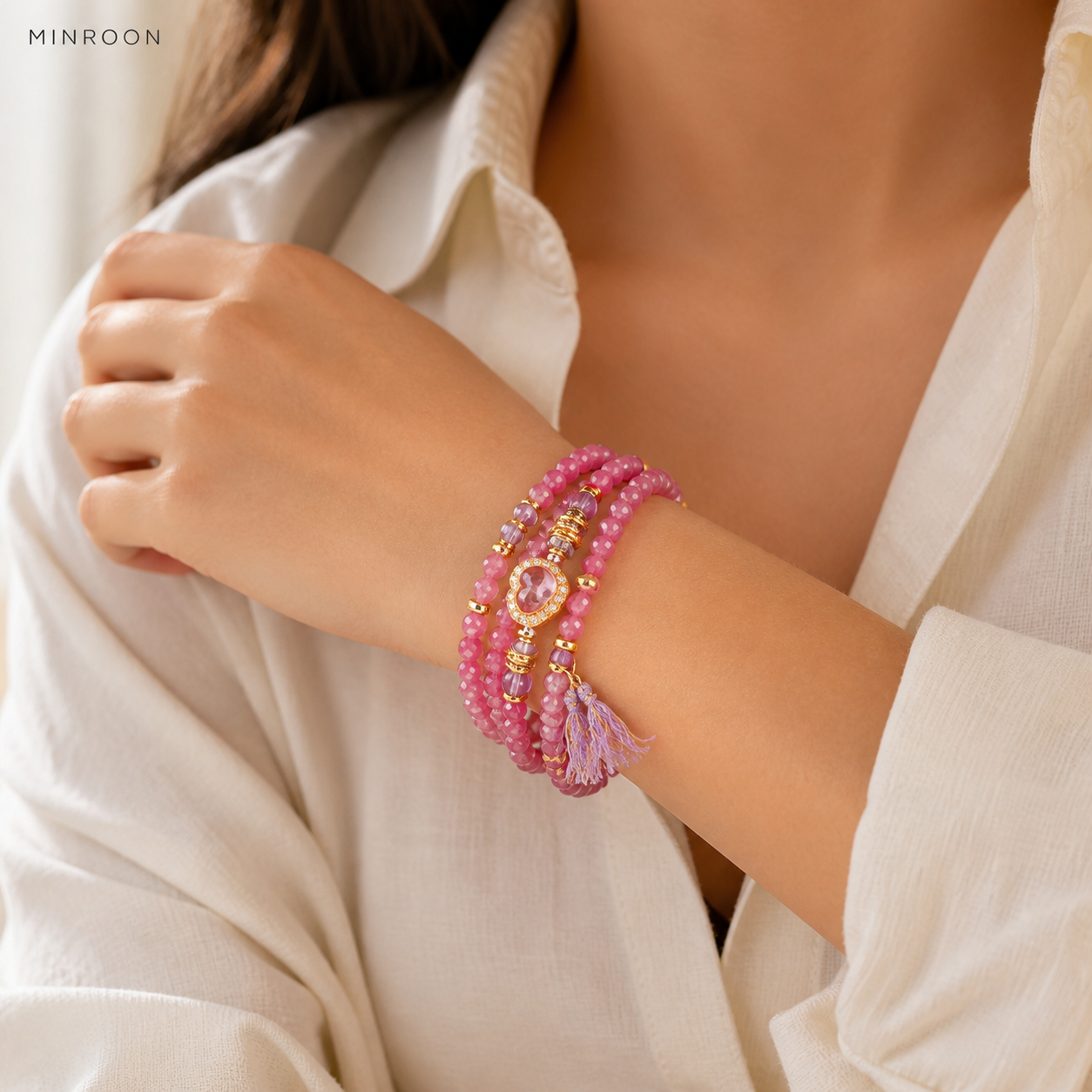 Aquarius pink tourmaline bracelet worn on wrist