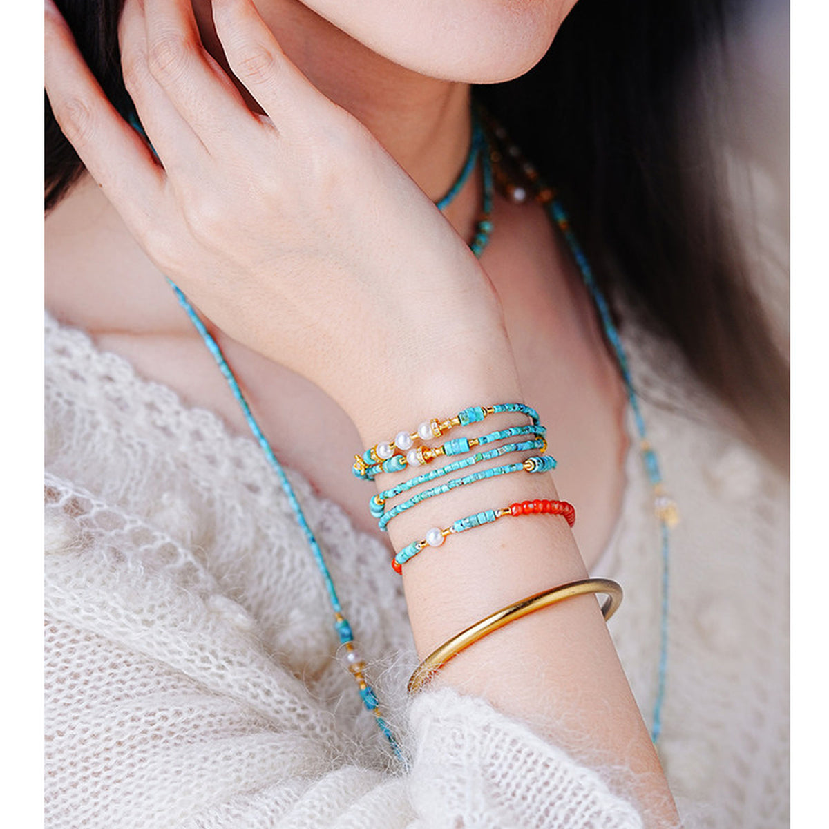 Turquoise necklace and layered bracelet complete styling
