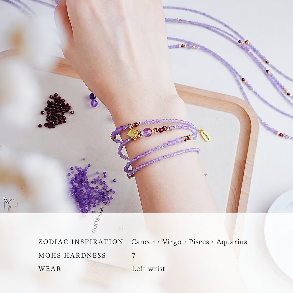 Amethyst wrap bracelet worn on the wrist with English care notes