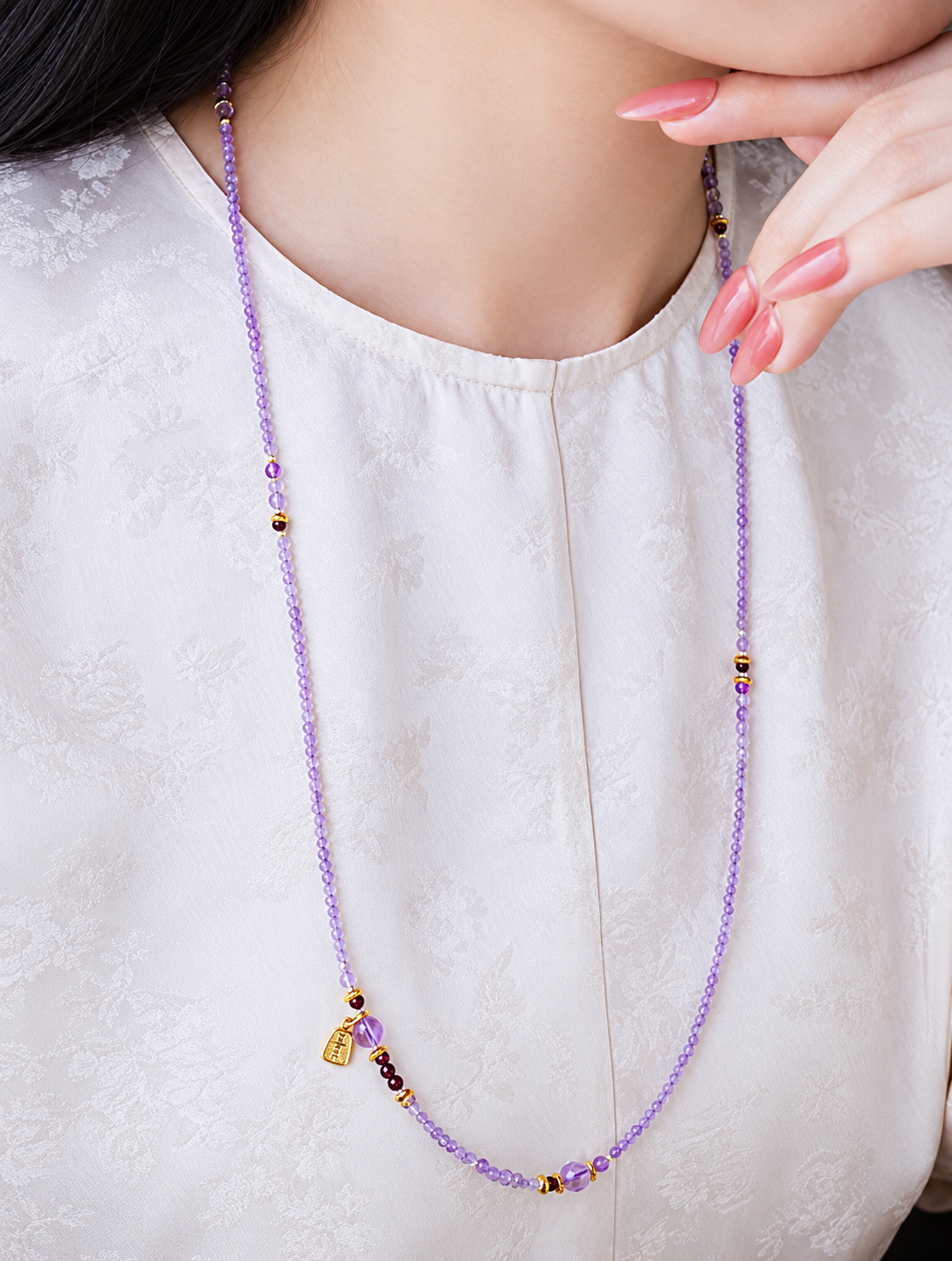 Joy Charm amethyst strand worn as a necklace in a restored styling photograph