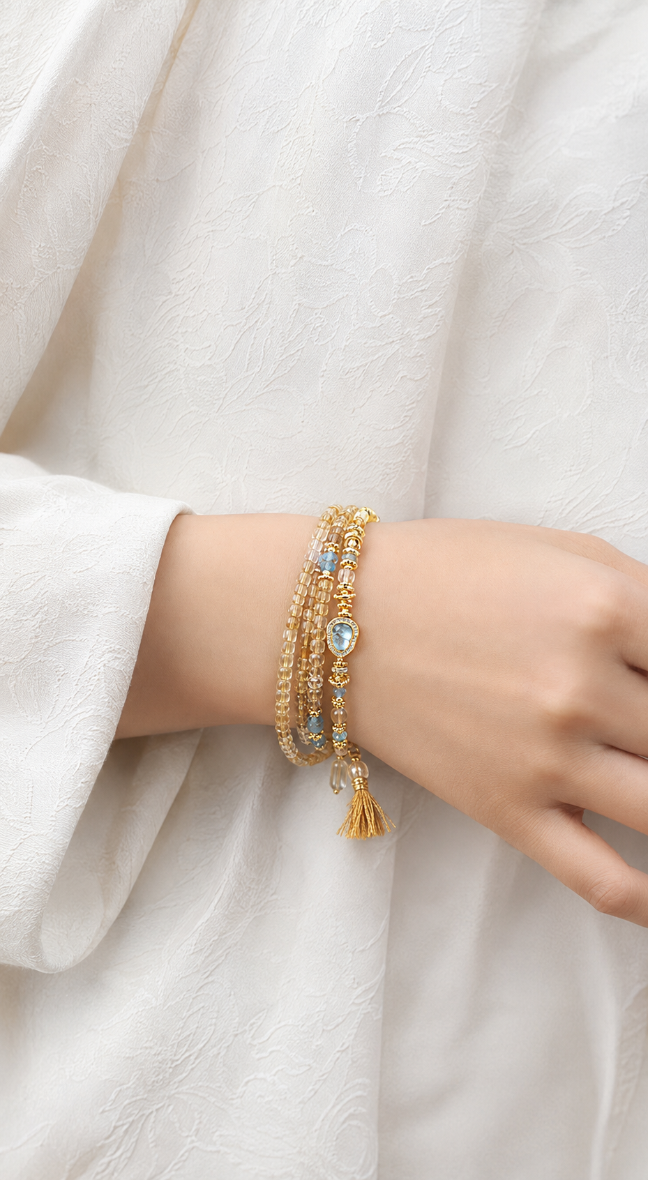 Pisces natural citrine and aquamarine bracelet worn on a model wrist