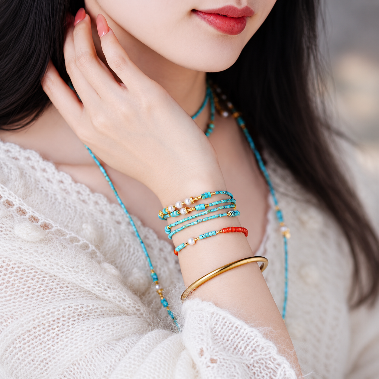 Layered turquoise Landscape Poetry bracelets worn on the wrist