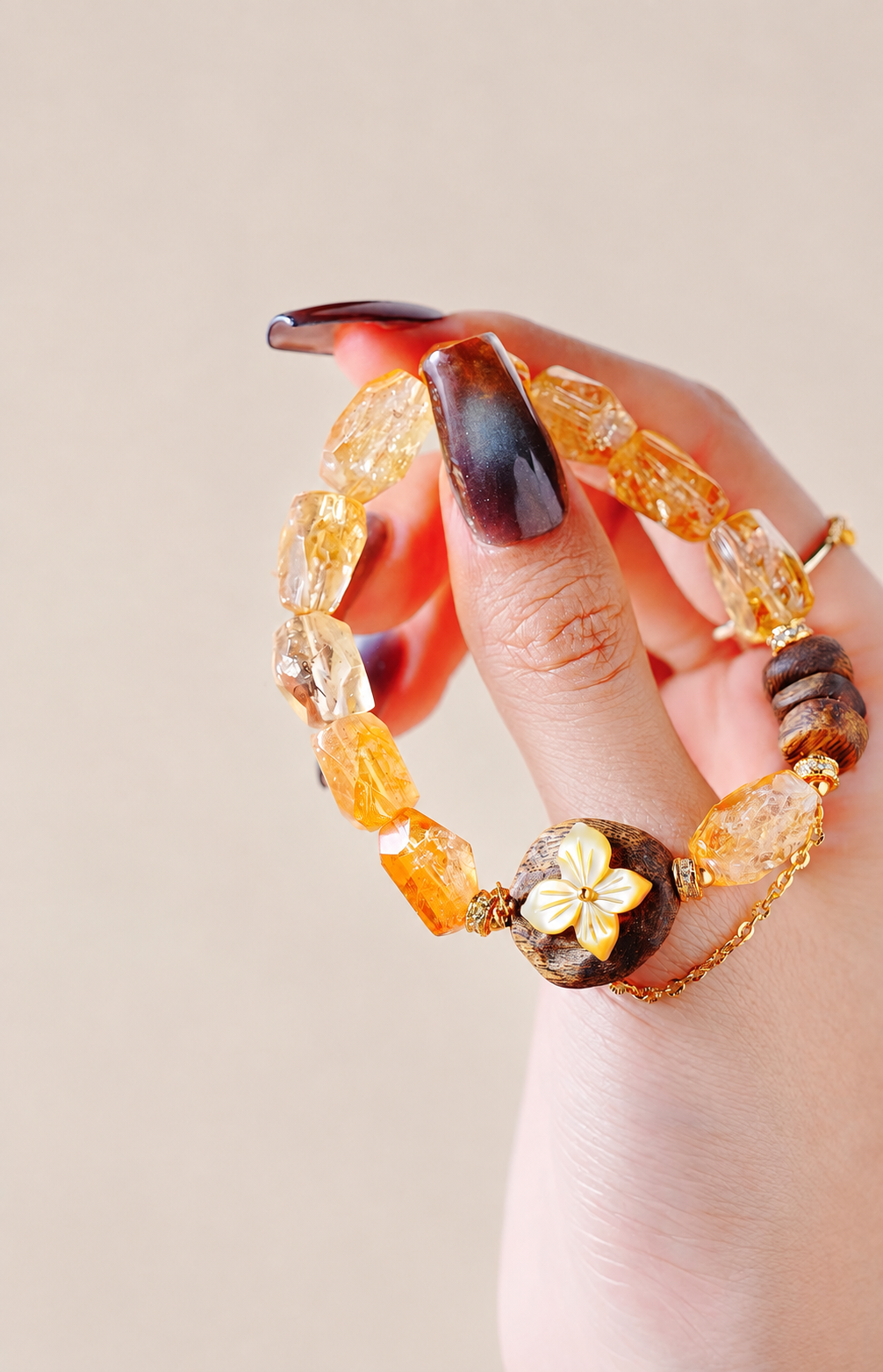 Yellow crystal bracelet held in hand